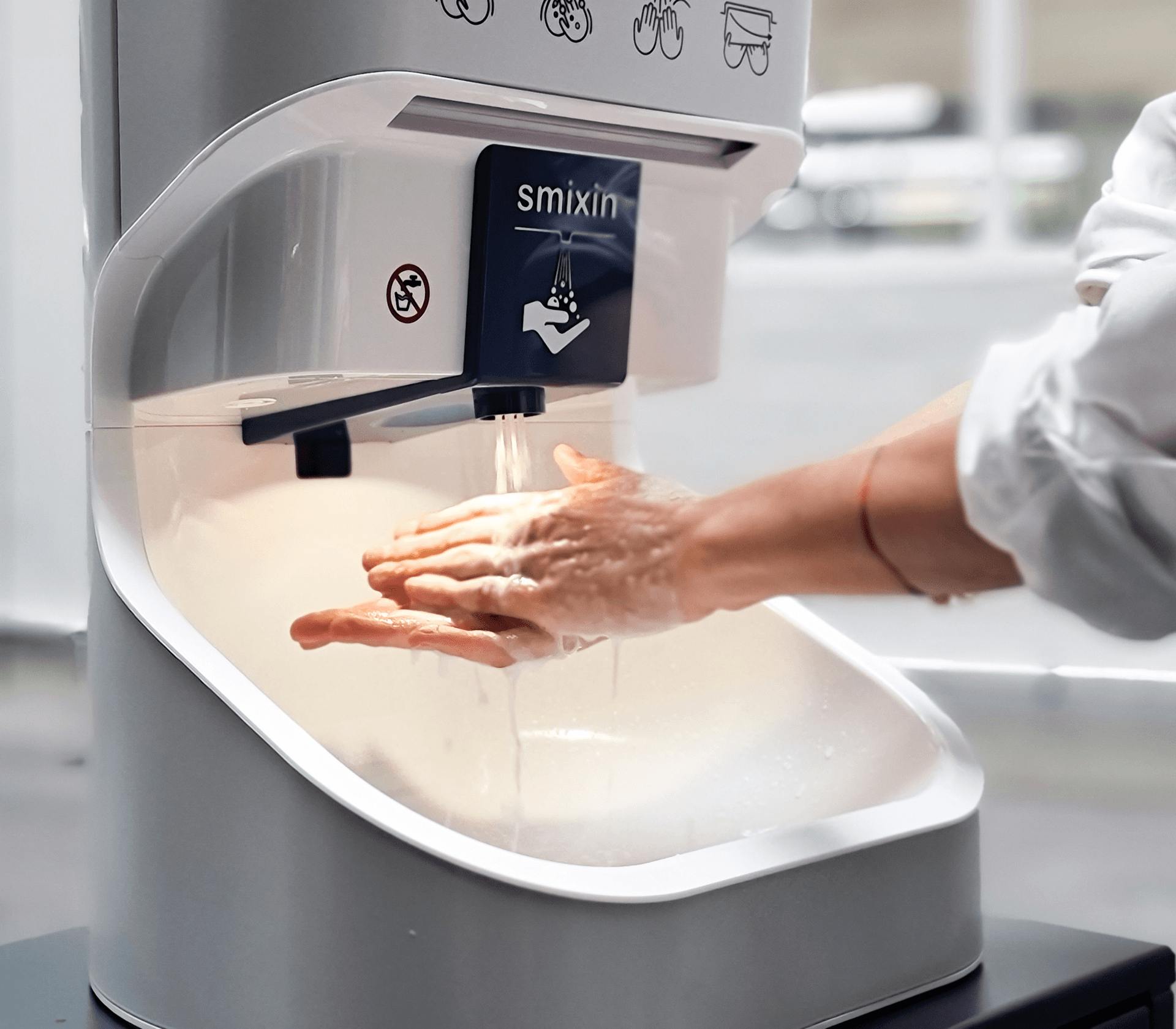 User demonstrating SMIXIN smart contactless hygiene system